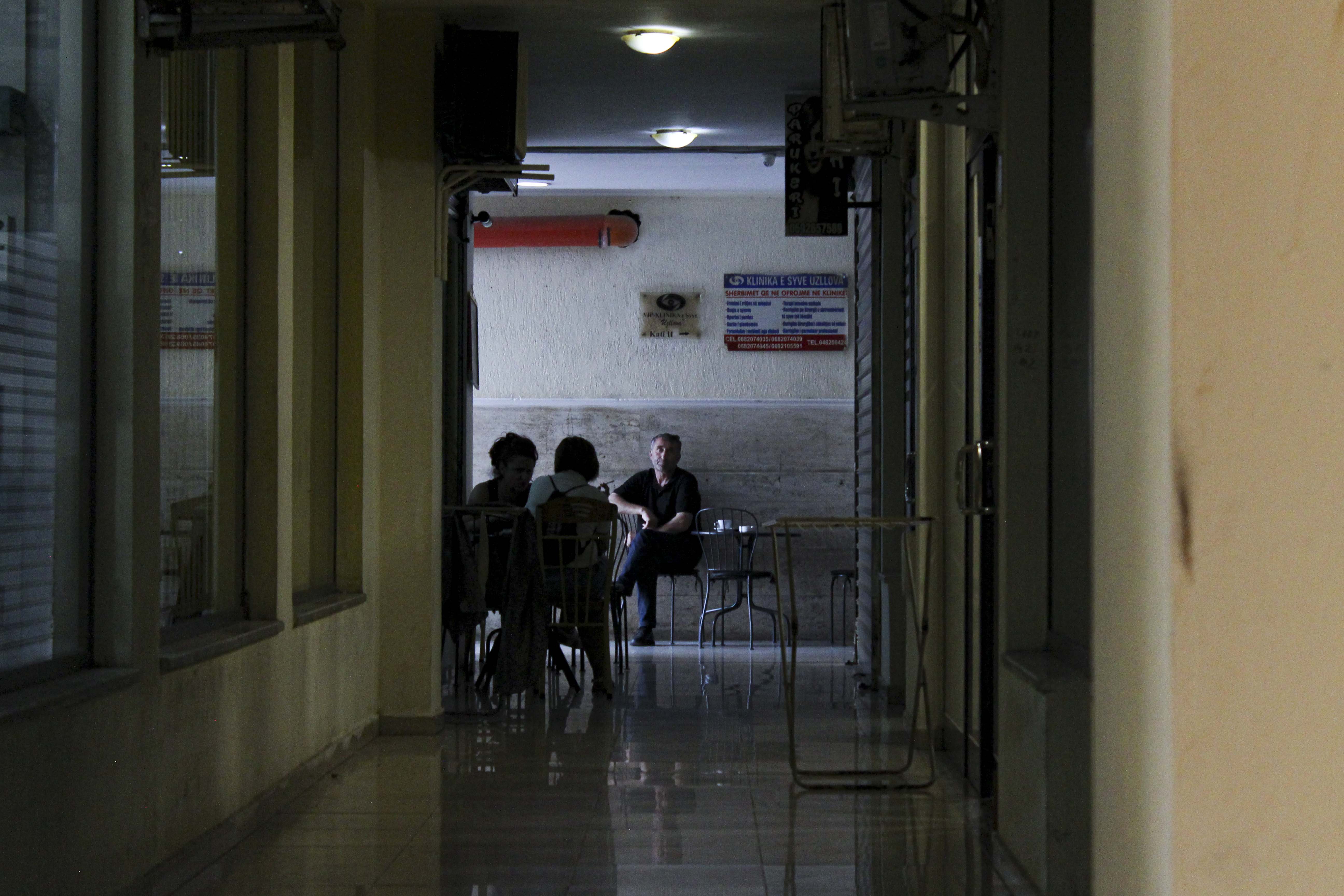 A man sits in a simple âcafeâ in the hallway of an apartment building in Tirana, Albania on Thursday, Aug. 27, 2020. Albania is ranked the first in the world to have the most coffee bars per capita, with a cafe around literally every corner in Tirana, a cup of coffee can be served as long as there is a table and a chair. (Photo by Meng Wei)